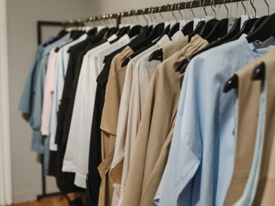 Stylish clothes hanging on a rack, showcasing a variety of elegant fashion pieces.